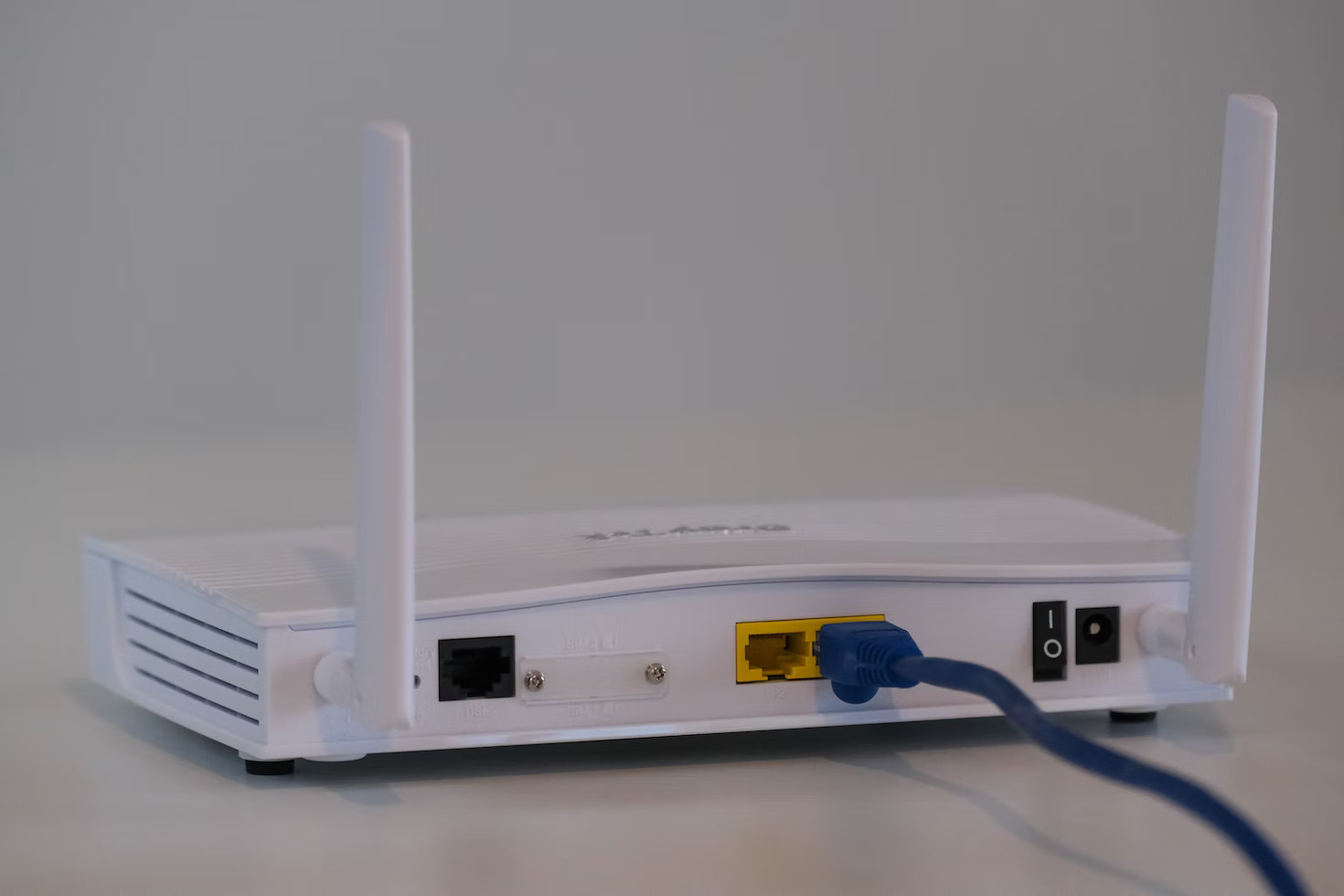 A router with an ethernet cable plugged in