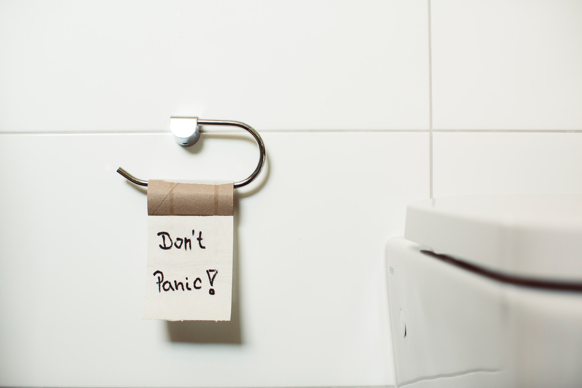  A photo of a toilet roll with ‘Don’t Panic’ written on it